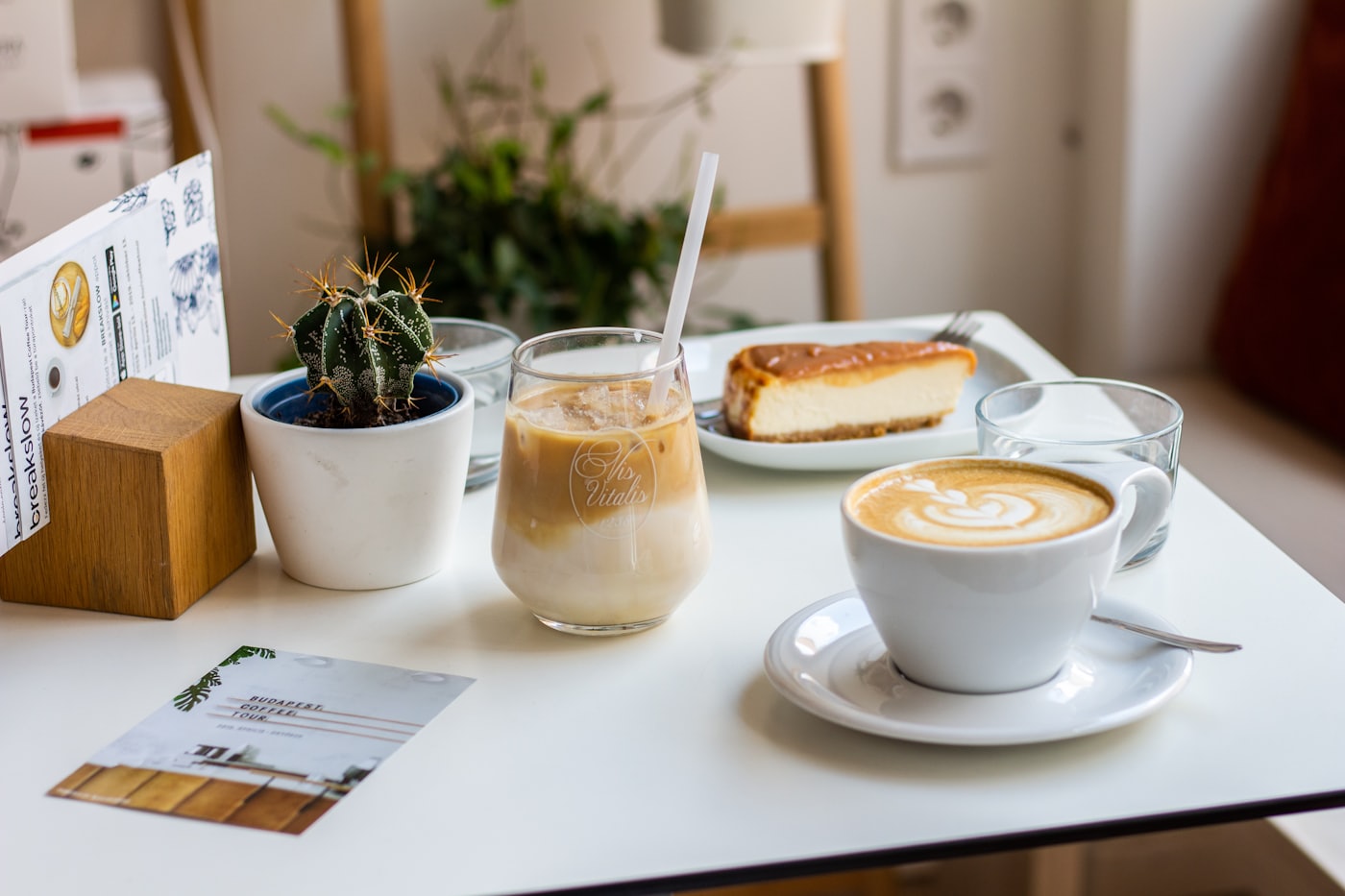 A flat white and an iced coffee on the counter at Four Espresso